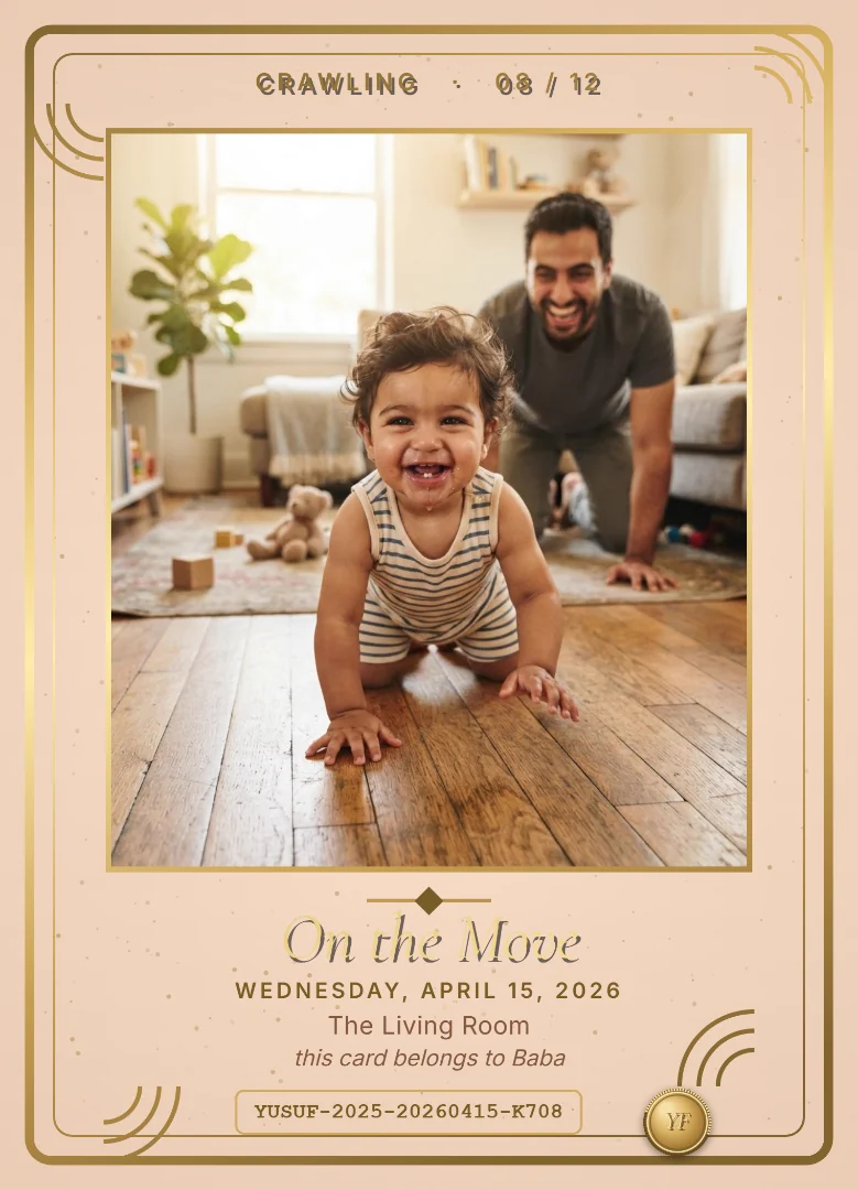 An eight-month-old baby crawling straight at the camera with a huge grin while his father laughs behind him, on a peach and gold keepsake card