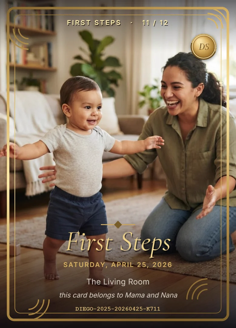 An eleven-month-old boy taking his first steps toward his laughing mother on a wooden living room floor, on a full-bleed black and gold keepsake card