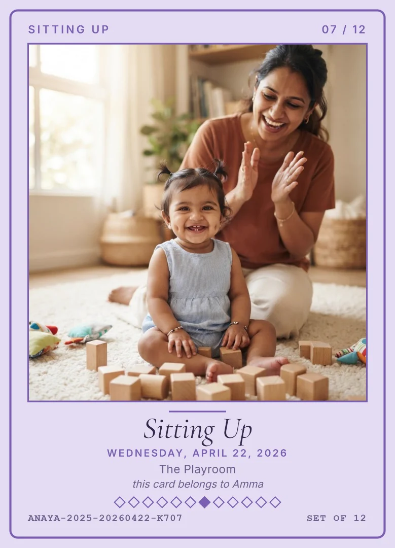 A seven-month-old baby girl sitting up among wooden blocks while her mother claps, on a lavender keepsake card